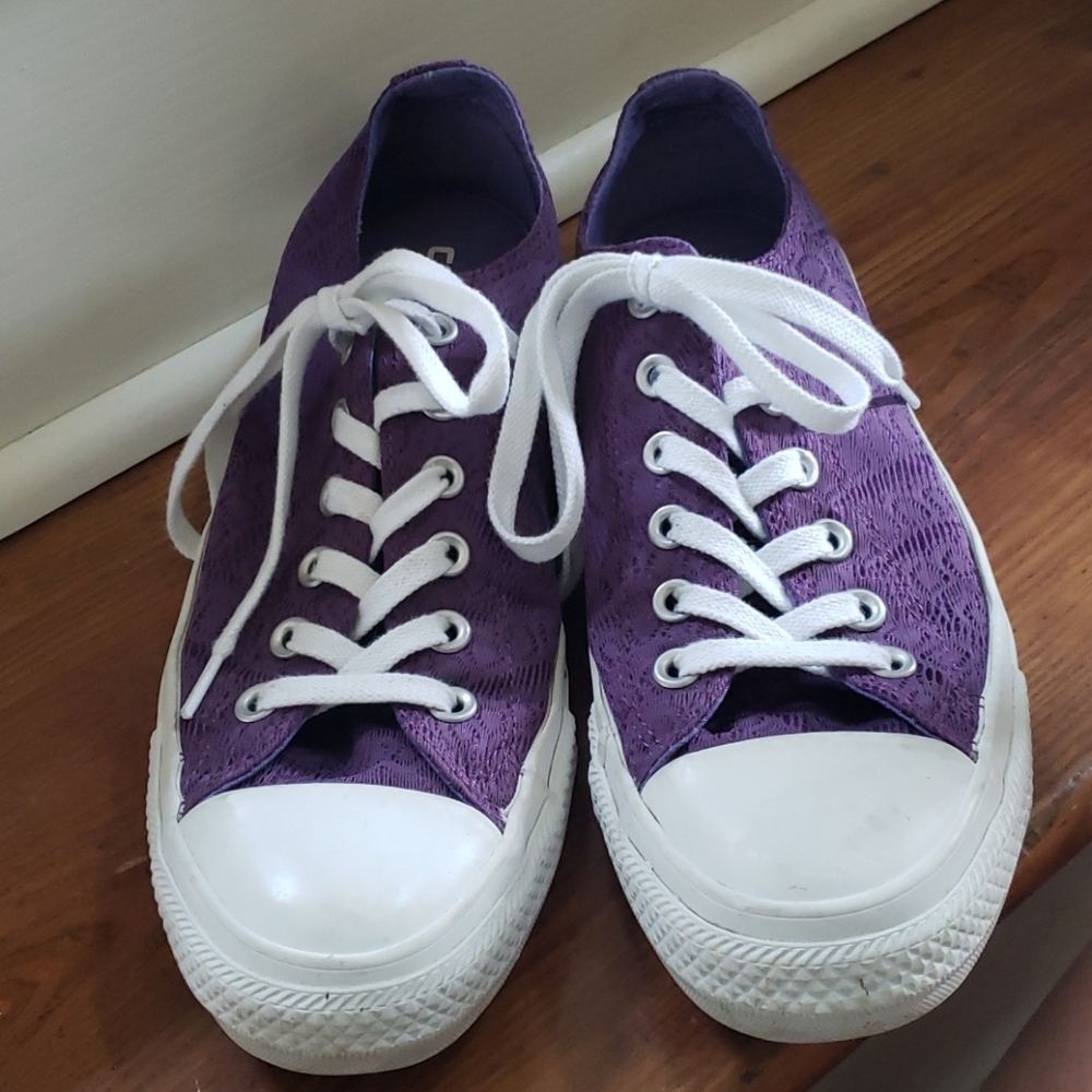 Converse low tops with purple lace